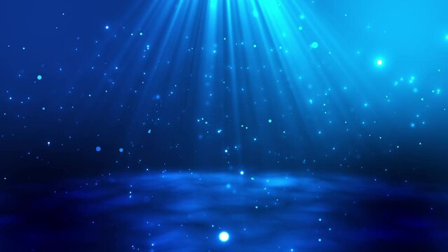 Abstract blue particles background. Beautiful waves and flying luminous particles, rain of dots. beautiful bokeh. Spotlight or rays of light.