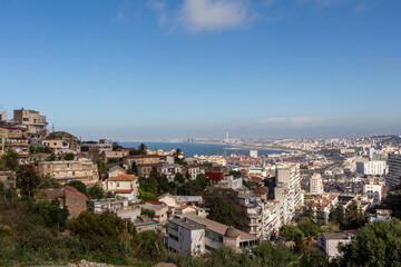 Fototapeta na wymiar Beautiful panorama of the bay of Algiers, Alger, Algeria, with the industrial port and the Djamaa El-Djazaïr (English : Great Mosque) in the background.