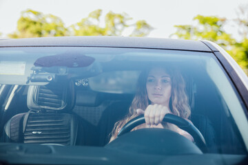 woman behind the wheel of a car car lady motorist trip travel