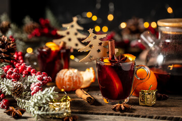 Hot red mulled wine in glass with orange, Traditional hot drink or beverage, festive cocktail