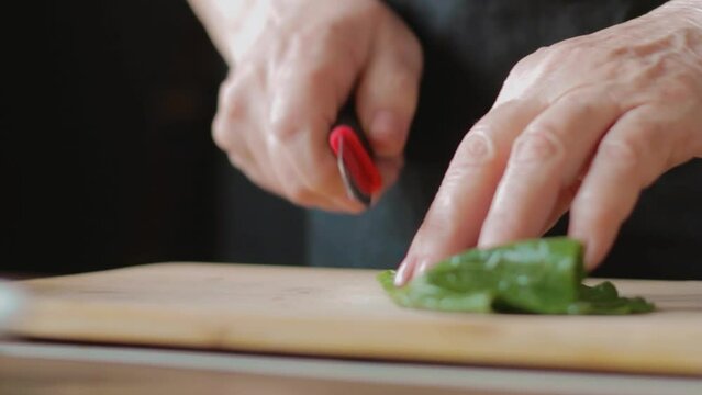 cleaning and cutting collard greens leaves