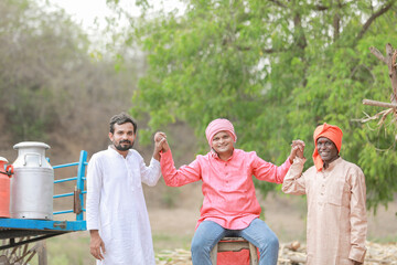Group of three asian male farmer smile and thumb up standing in farm, close friends