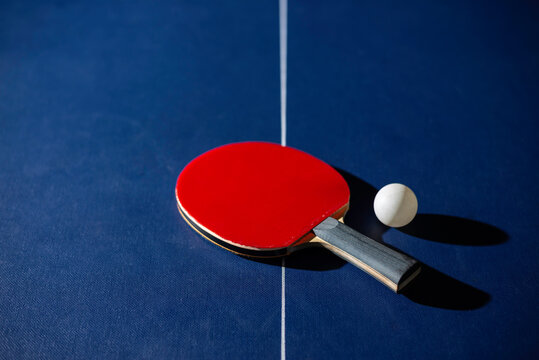 table tennis racket On the blue ping pong table