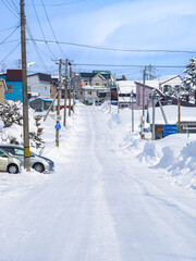 Streight road in a heavy snowfall area (Niseko, Hokkaido, Japan)