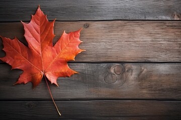 Obraz premium Autumn's Gentle Embrace: A Lone Maple Leaf on Rich Wooden Planks Showcasing Nature's Beauty. Generative AI