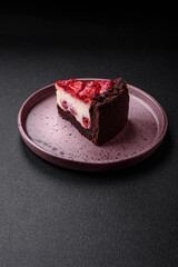 Beautiful tasty sweet slice of cheesecake with cherry on a ceramic plate
