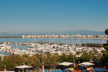 View of the port of Roses. In the distance the urban area. Roses is located on the Costa Brava and...