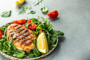 Grilled chicken breast with tomatoes and herbs, Healthy, clean eating. place for text, top view
