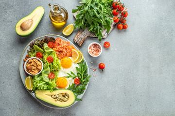 Ketogenic diet breakfast vegetables salad, avocado, fish, eggs, nuts with bulletproof keto coffee. place for text, top view