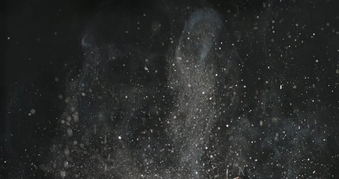 Splashes and smoke from cooking cutlets, meat, bacon, pork, beef, halal, vegetable protein simulating meat, soy protein on black background. Cinematic advertising video. Cooking in kitchen