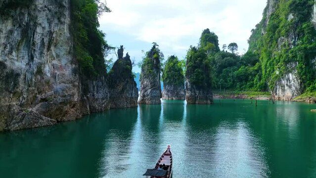 Aerial view at Khao Sok national park Cheow Lan Dam lake with blue sky background in Surat Thani, Thailand	