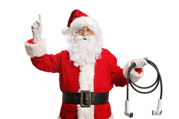 Santa claus holding electric vehicle charger and pointing up