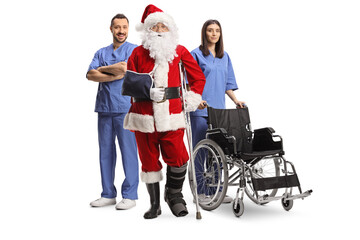 Injured santa claus with a foot brace and arm sling standing with a medical team