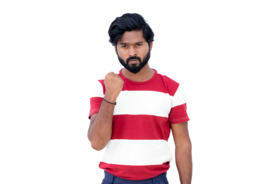 a man with a beard and a red and white shirt is posing for a picture with his fist raised