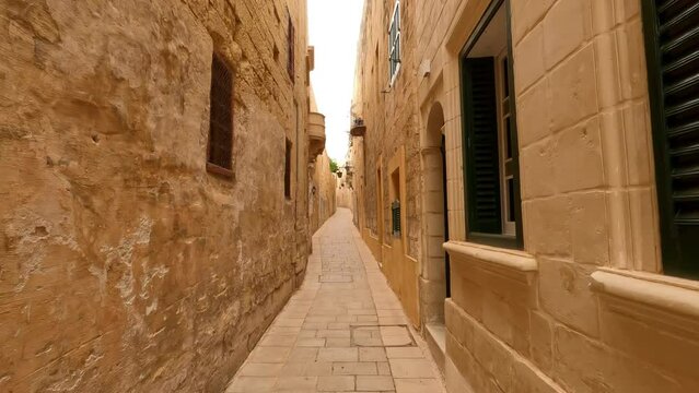 Steadily walking through the tight streets of Valletta Malta