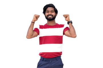 a man with a beard and a red and white shirt is raising his fists in victory with both hands