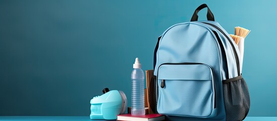 School going students should carry school essentials like a backpack masks and sanitizer for COVID 19 prevention With copyspace for text