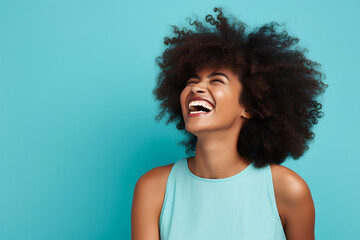 Beautiful african american woman with afro hairstyle laughing on blue background. ia generated