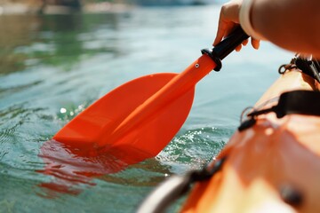 Kayak paddle sea vacation. Person paddles with orange paddle oar on kayak in sea. Leisure active lifestyle recreation activity rest tourism travel