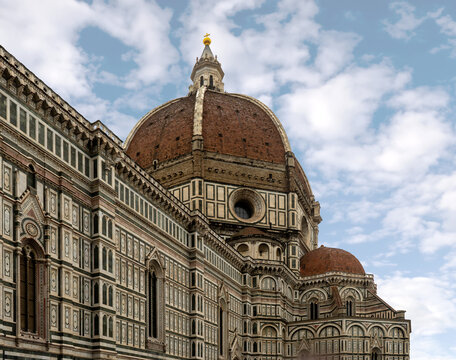 Florence Cathedral facade - Duomo di Firenze. Beautiful religious building with cloudy sky