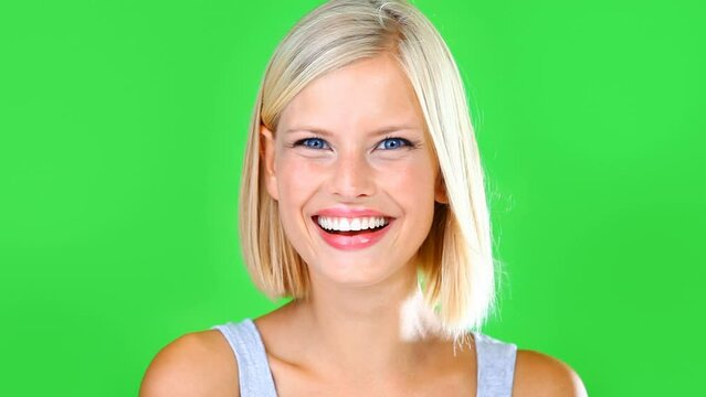 Green screen, fist knocking and woman wink in studio isolated on a background. Hand of person tapping on door, blink gesture and call, communication or sign to welcome guest in home in portrait