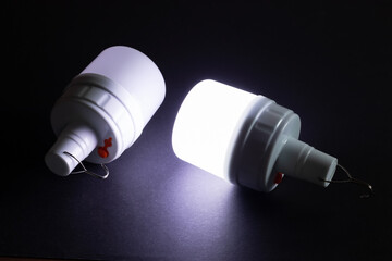 Two white emergency led bulbs with integrated battery