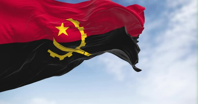 Angola national flag waving in the wind on a clear day