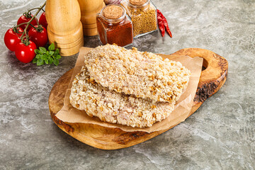 Breaded raw breaded meat schnitzel