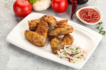 Grilled chicken wings with sauce