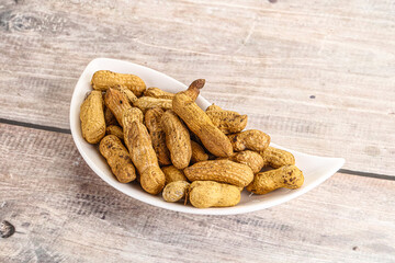 Raw ripe unpeeled peanut heap
