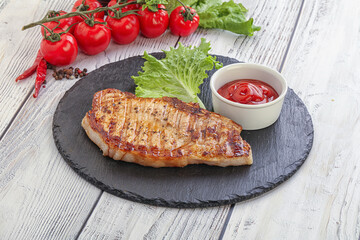 Grilled pork steak with ketchup