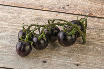 Ripe tasty black cherry tomato