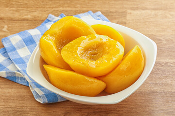 Sweet canned peaches with syrope