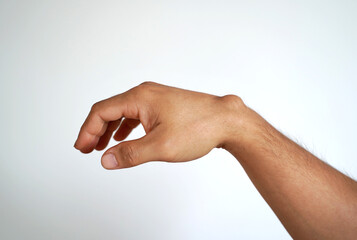 Ganglion cyst on man's hand on white background