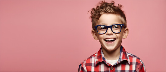 Excited smiling boy on solid color background