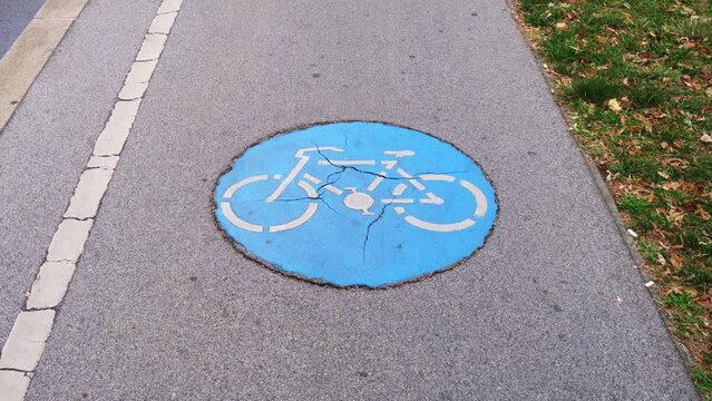 Bicycle signs on ground in timelapse match cut technique, concept for urban mobility. Alternative transportation, bike lane, bikeway, street sign.