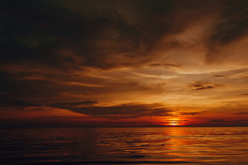 Naklejka na ściany i meble Dark red sunset over the sea