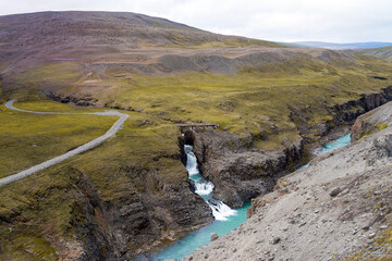 Basalt columns in Studlagil canyon in Iceland. Lava flows in Northeast Iceland, Bru river in...