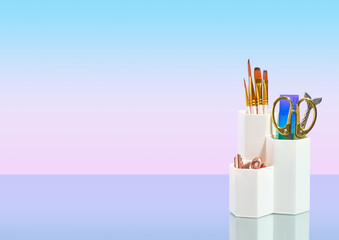 School supplies composition. Paint brushes, line and scissors for good study and art work. Copy space for text.