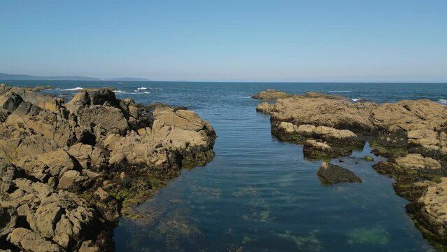 Rocky Beach With Lagoon In Caion, A Coru&ntilde;a, Spain. pullback 