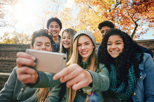 Selfie, vacation or friends in park for social media, online post or profile picture in autumn or nature. Smile, boys or happy gen z girl students taking photograph on fun holiday to relax together