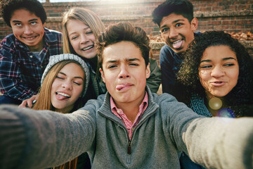 Selfie, funny face or portrait of friends in park for social media, online post or profile picture in autumn. Boys, girls or gen z people taking photograph on fun holiday vacation to relax in nature