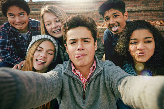 Selfie, funny face or portrait of friends in park for social media, online post or profile picture in autumn. Boys, girls or gen z people taking photograph on fun holiday vacation to relax in nature