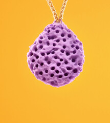 The purple shower sponge is textured and porous. Self care idea.