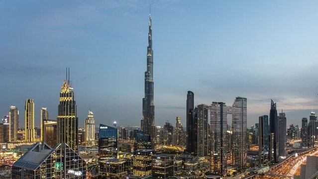 Time lapse of Burj Khalifa skyline in Dubai from night to day - aerial view, United Arab Emirates