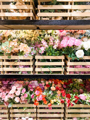 Bouquet of artificial flowers in a rack