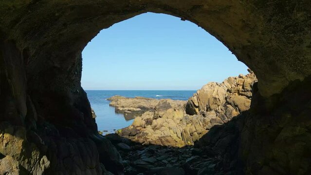 Furna de Caion - Cave of Caion Overlooking The North Atlantic Ocean On A Sunny Summer Day In Spain. - aerial