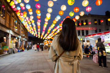 Fototapeta premium Woman go Dihua street to enjoy New year decoration in Taipei city