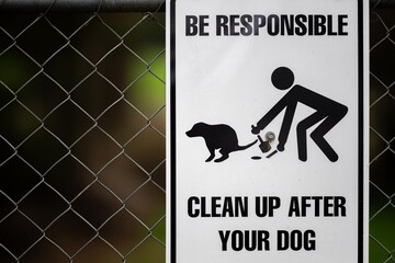 pick up dog poo sign in a park - obrazy, fototapety, plakaty