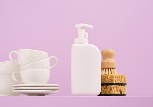 Set of clean tableware and washing dishes in the kitchen. Idea of housework and hygiene.